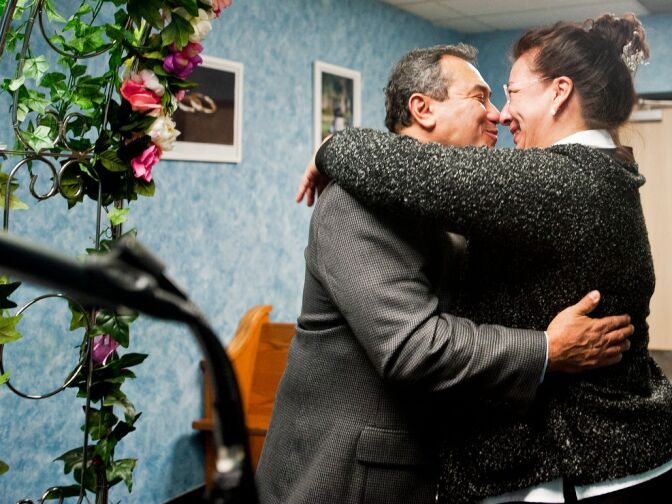 Louis Martin Cardo, 58, and Maria Elena Benson rub noses before kissing, to conclude their wedding ceremony.