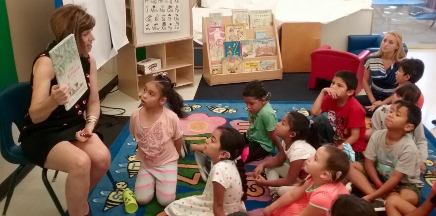 Debra Schrader reads with the children in USC's Come Read with Me program for English learners who are deaf or hard of hearing.