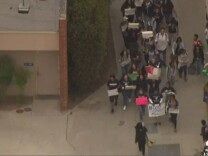 Students marching at Los Angeles-area Mayfair high School on Friday, Oct. 17 after a noose was found hanging on campus, as seen in an NBC L.A. screenshot.