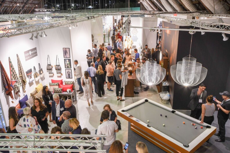 A crowd shot of the interior aisles of the WestEdge Design Fair, shot from above.