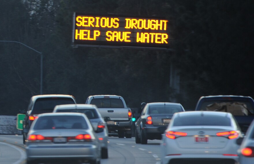 A sign over a highway in Glendale, California warns motorists to save water in response to the state's severe drought, February 14, 2014.  US President Barack Obama is visiting drought-stricken California today and is expected to announce more than $160 million in federal financial aid to help California recover from the crippling drought that is threatening the state's agriculture industry. AFP PHOTO / ROBYN BECK        (Photo credit should read ROBYN BECK/AFP/Getty Images)