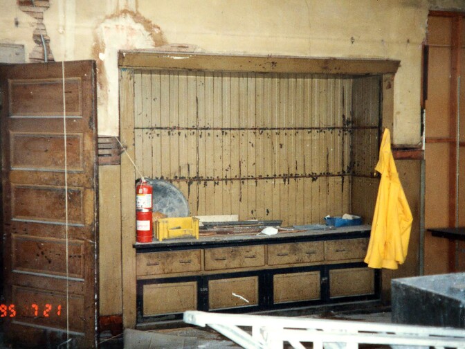 Conditions inside the Italian Hall prior to its restoration show its deterioration. Pictured are the remnants of original cabinets and drawers where plates and flatware were once stored.