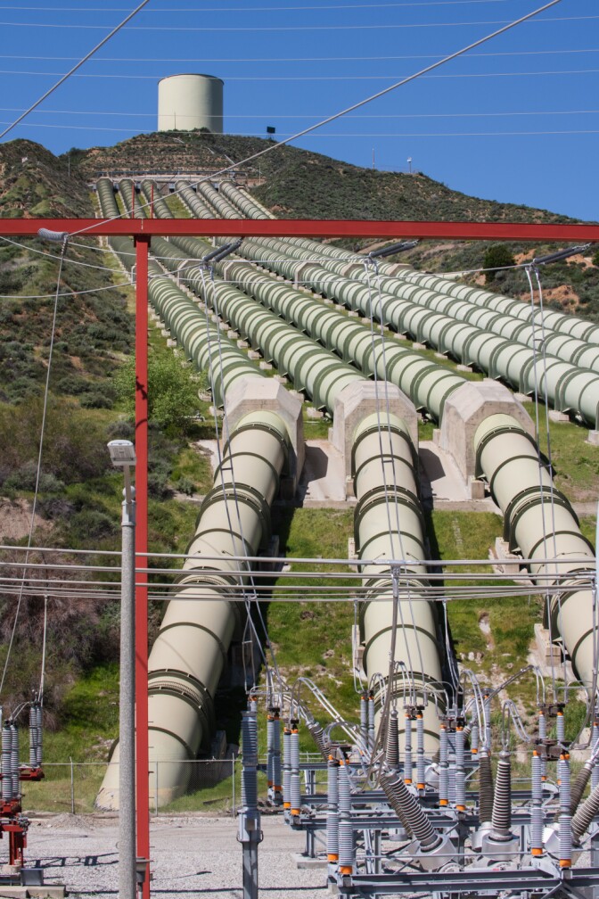 A set of pipes called the pen stock is the last stage of the seven-and-a-half mile journey for water being pumped from Pyramid Lake to Castaic Hydroelectric Power Plant in Castaic, California. Transformers and other equipment based on site transfer electricity produced at the site to a set of transmission lines that bring power to Los Angeles for periods of peak demand.