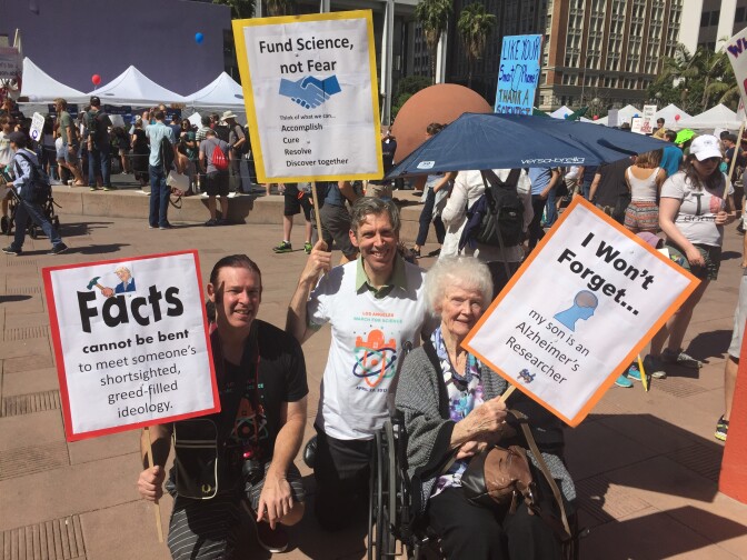 Michael Sawaya, a biologist at UCLA, is joined by his brother and mother at the March for Science in Los Angeles on April 22, 2017. 