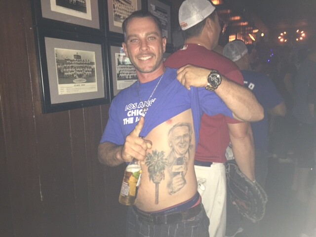 Mark Morocco of Palm Springs shows off his Vin Scully tattoo at the Short Stop bar during Game 1 of the 2017 World Series.
