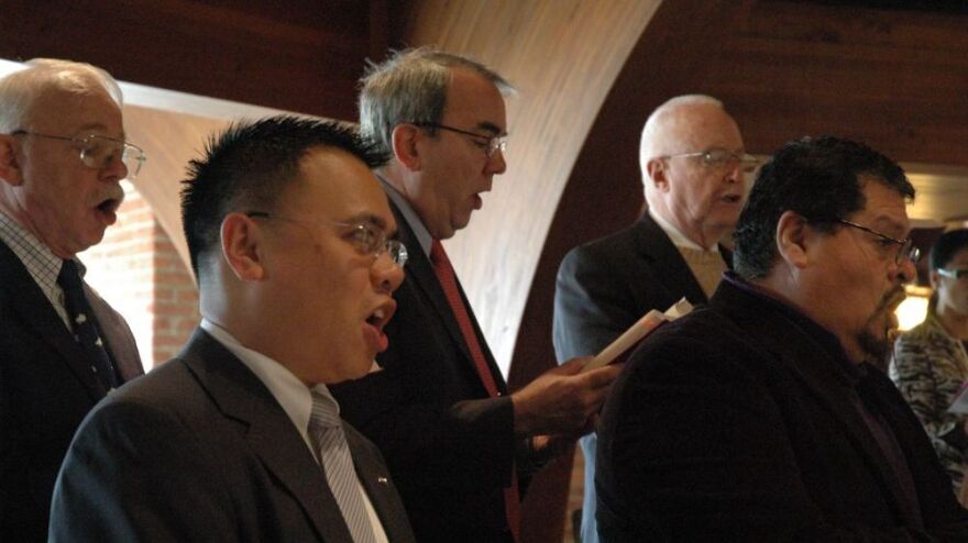 Members of the St. Agnes Catholic Church choir sing during Sunday Mass. From left to right: Donald Hukle, Ray Valido, Richard Samp, Jack Grace and Ben Robles.
