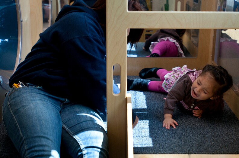 One-year-old Melanie wants her mom to go down the slide. Her second birthday is in June. A friend told Michelle Zamora about North Park High School, a continuation school, where Zamora could take classes while Melanie is in childcare.