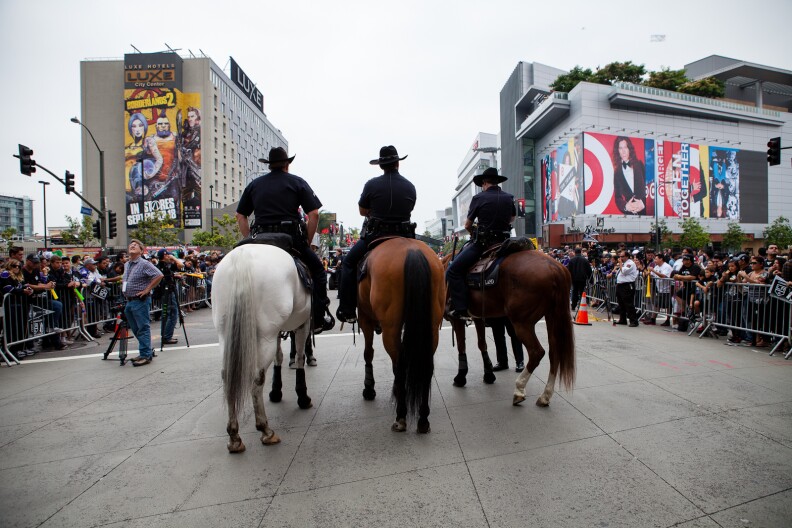 Mounted police keep an eye on the crowd just before the LA Kings arrived during their parade.