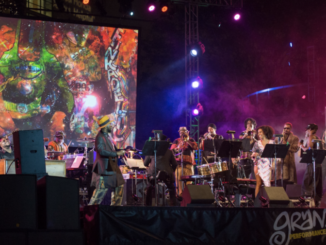 A musical act plays to an enthusiastic audience as part of Grand Performances, a free concert series in downtown Los Angeles.