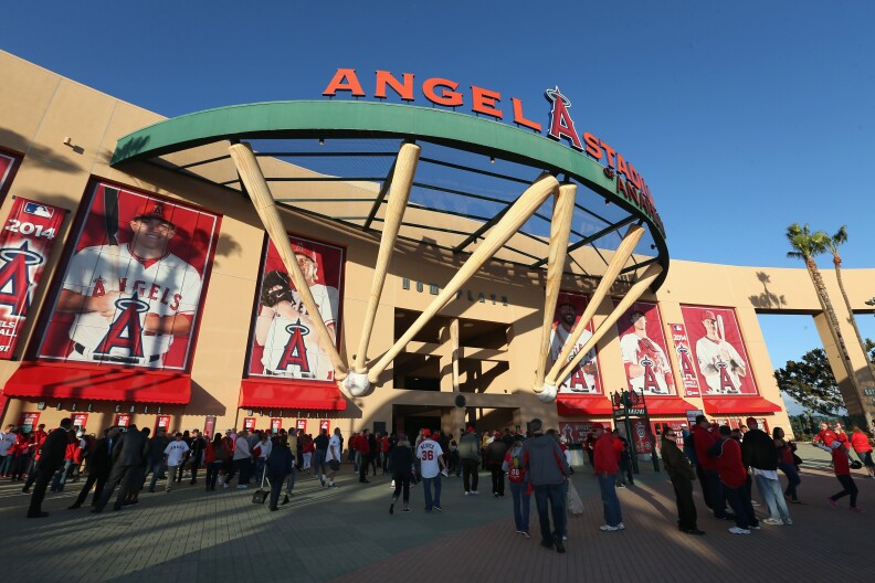 Fans enter Angel Stadium of Anaheim on Opening Day prior to the start of the game between the Seattle Mariners and the Los Angeles Angels of Anaheim on March 31, 2014 in Anaheim, California. 