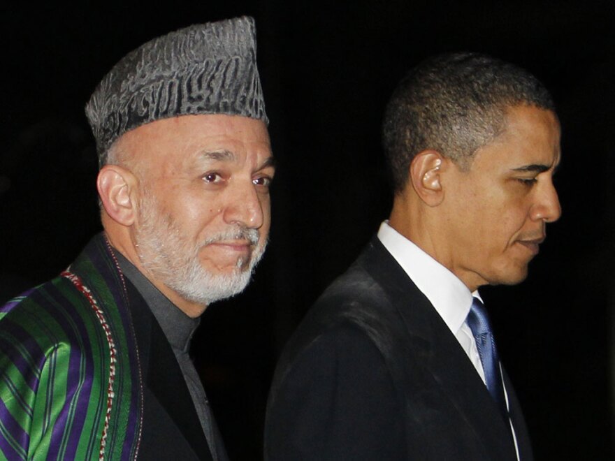 President Obama walks with Afghan President Hamid Karzai at the presidential palace in Kabul on March 28. In recent comments, Karzai has blamed the West for many of his troubles, causing concern in Washington.