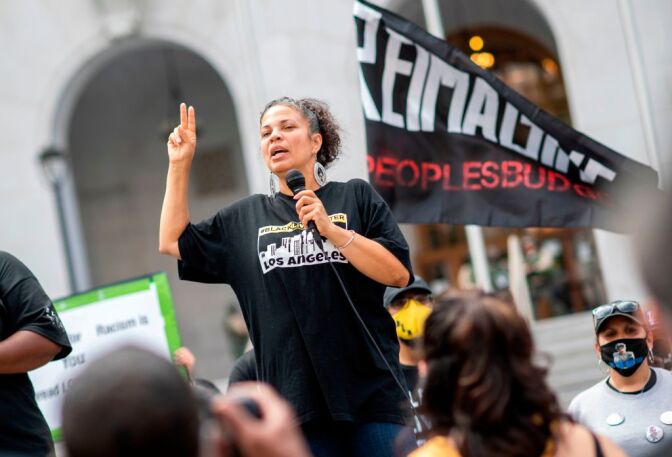 Melina Abdullah from Black Lives Matter addresses the crowd during a demonstration to ask for the removal of District Attorney Jackie Lacey in front of the Hall of Justice, in Los Angeles, California, on June 17, 2020. (Photo by VALERIE MACON / AFP) (Photo by VALERIE MACON/AFP via Getty Images)