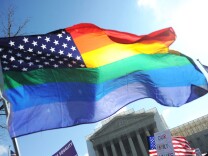 File: Same-sex marriage supporters wave a rainbow flag in front of the U.S. Supreme Court on March 26, 2013 in Washington, D.C.