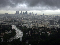 LOS ANGELES - FEBRUARY 22: Downtown Los Angeles (top) and Hollywood (R) are visible during a short break in the rain as the region is under a tornado watch and Orange County is under a tornado warning February 22, 2005 in Los Angeles, California. This is now the third wettest season on record for southern California and with two months left in the season, it could become the rainiest since records began in 1877. (Photo by David McNew/Getty Images)
