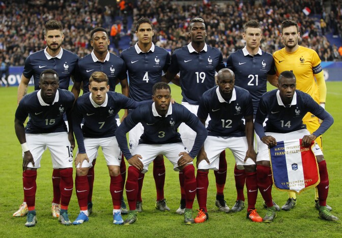 France's team front row from left,,  Bacary Sagna, Antoine Griezmann, Patrice Evra, Lassana Diarra and Blaise Matuidi, back row from left, France’s Olivier Giroud, Anthony Martial Anthony, Raphael Varane, Paul Pogba, Laurent Koscielny and goalkeeper Hugo Lloris during their international friendly soccer match France against Germany at the Stade de France stadium in Saint Denis, outside Paris, Friday Nov. 13, 2015 in Paris, (AP Photo/Michel Euler)