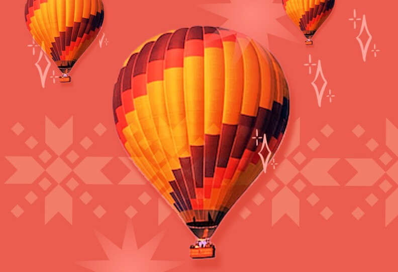A image of hot air ballon against a red holiday back drop