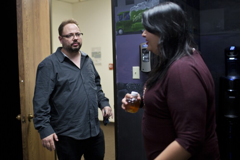 Founder Jeremy Hansen, left, works with Board Operator Cheyenne Hayes at SkidRow Studios on Wednesday evening, Feb. 25, 2015. Hansen first opened Skidrow Studios in 2011.