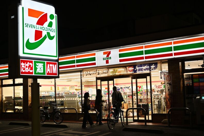 A 7-eleven convenience store at night in Japan.