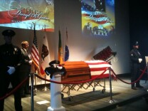 The casket of former LAPD Chief Daryl Gates sits in the auditorium at police headquarters Monday. Hundreds of current and former officers paid their respects.