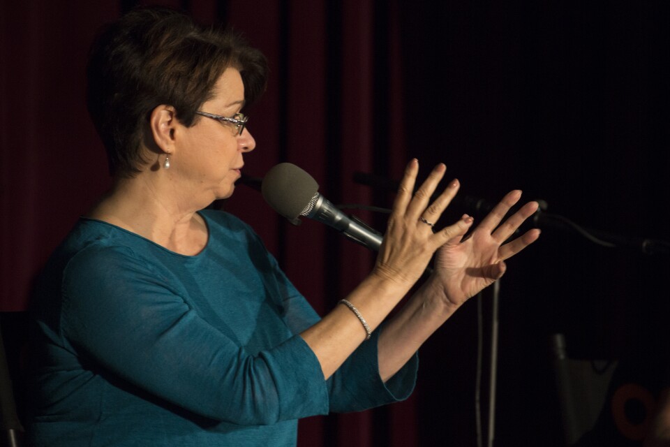 Financial planner Delia Fernandez addresses the crowd at KPCC/Take Two's event Millennial Matters.