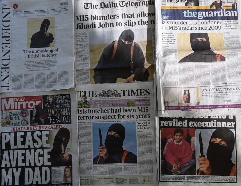 An arrangment of British daily newspapers photographed in London on February 27, 2015 shows the front-page headlines and stories regarding the identification of the masked Islamic State group militant dubbed "Jihadi John". The British headlines were dominated on Febryary 27 by the story of the identification of the Islamic State executioner. "Jihadi John", the masked Islamic State group militant believed responsible for beheading of at least five Western hostages, has been named as Kuwaiti-born computing graduate Mohammed Emwazi from London.  AFP PHOTO / DANIEL SORABJI        (Photo credit should read DANIEL SORABJI/AFP/Getty Images)