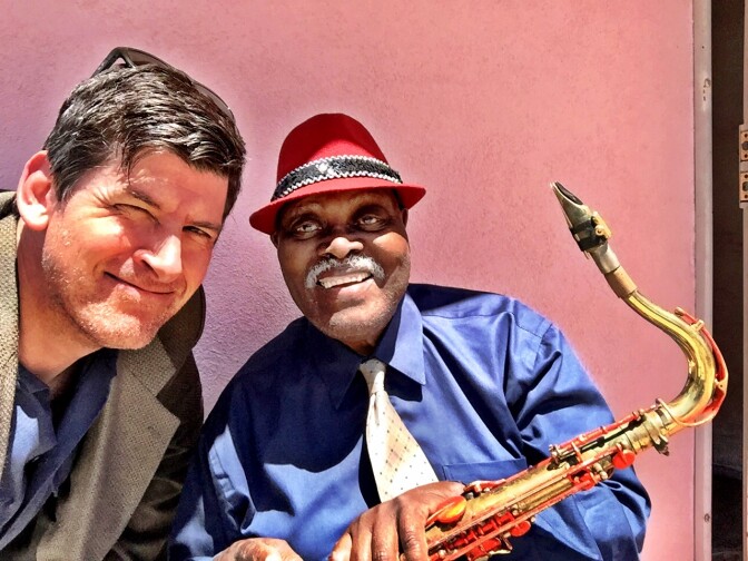 Off-Ramp host John Rabe with 90-year old sax legend Big Jay McNeely outside McNeely's home in South LA. 