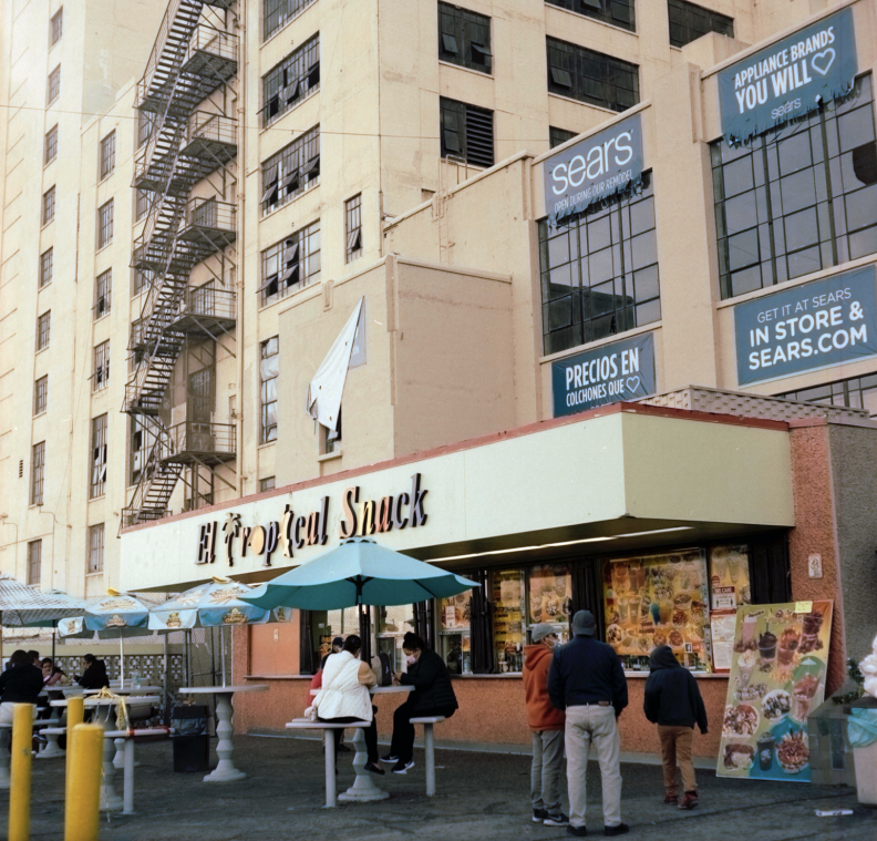 Customers at the El Tropical Snack bar outside the Boyle Heights Sears in March, 2021.