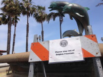 The iconic Dolphin Fountain near Santa Barbara's popular beach promenade has been turned off to save water during the drought. 