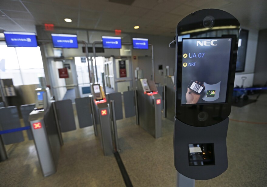 File: A U.S. Customs and Border Protection facial recognition device is ready to scan another passenger at a United Airlines gate, Wednesday, July 12, 2017, at George Bush Intercontinental Airport, in Houston.