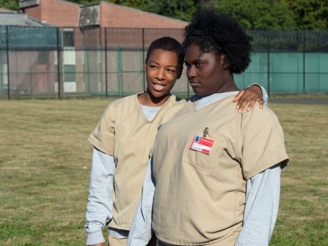 Samira Wiley (L) portrays the gay character Poussey Washington on Netflix's "Orange is the New Black." 