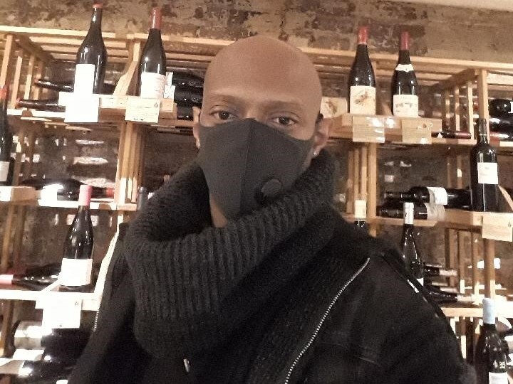 Karim Soumah works at a wine bar in Washington, D.C., where tips have helped him make a good living.