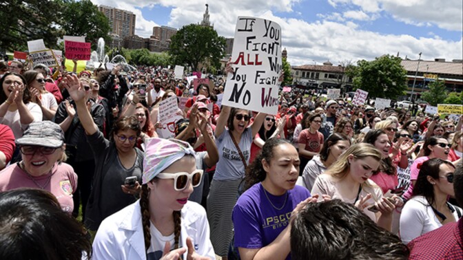 Several hundred spirited protestors marched through the Country Club Plaza Sunday, May 19, 2019, in response to the near-total abortion ban passed last week by Missouri legislators. The group then gathered at the J.C. Nichols fountain to hear speakers.