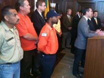 Los Angeles city workers join City Council President Eric Garcetti (at the podium) and Mayor Antonio Villaraigosa in announcing that most members of the Coalition of L.A. City Unions approved a deal to avoid unpaid furlough days.  Bargaining units representing more than 6,000 workers rejected the deal, and face 42 furlough days. 