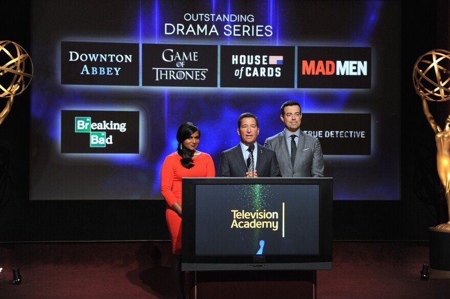 Actress Mindy Kaling, Television Academy Chairman & CEO Bruce Rosenblum and tv personality Carson Daly speak onstage at the 66th Primetime Emmy Awards Nominations at Leonard H. Goldenson Theatre on July 10, 2014 in North Hollywood, California. 
