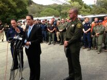 Orange County Supervisor Todd Spitzer speaks in front of rescuers who found two Orange County teen hikers alive.