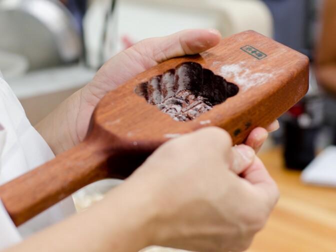 Bao Guo, a baker at Olympic Bakery, helps setup the tool used to mold the Mooncake’s design in Temple City, Calif., Monday September 24, 2012. The small pastries are made for the Chinese Moon Festival which takes place during the eight lunar month each year.