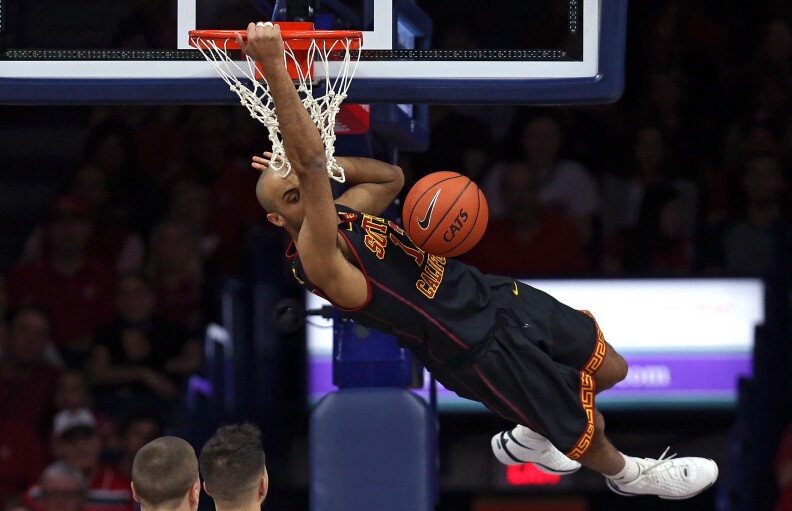 TUCSON, AZ - FEBRUARY 14: Julian Jacobs #12 of the USC Trojans dunks during the first half of the college basketball game against the Arizona Wildcats at McKale Center on February 14, 2016 in Tucson, Arizona. (Photo by Chris Coduto/Getty Images)