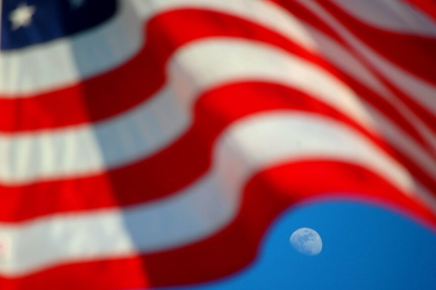 American flag with moon in the sky