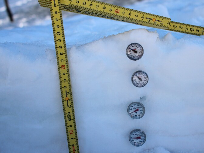 Temperature gauges often reveal different temperatures within a snowbank. The temperatures reflect the composition of the water within the bank.