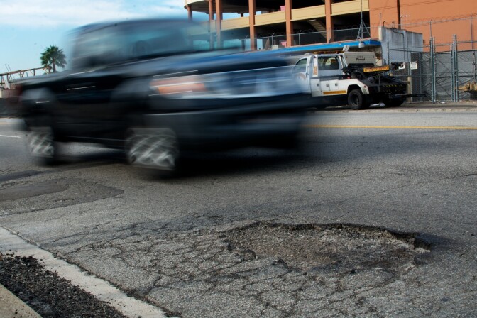 A pothole on Aviation Boulevard near LAX. The city is working on a backlog of reimbursements for car damage because of the numerous potholes that go unfixed.