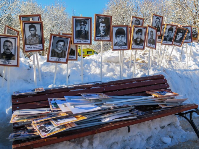 Photos of soldiers who served in Afghanistan are stacked up in a Moscow park after a ceremony marking the 30th anniversary of the Soviet Army's withdrawal. The memory of the disastrous and unpopular war has guided recent Russian military interventions.