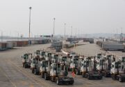 Trucks remain idle at the APM Terminals at the Port of Los Angeles as a result of the clerical workers strike.