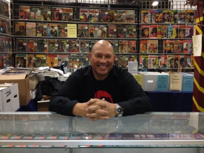 Vendor Leo Millan sits in front of his booth at Frank & Son Collectible Show.