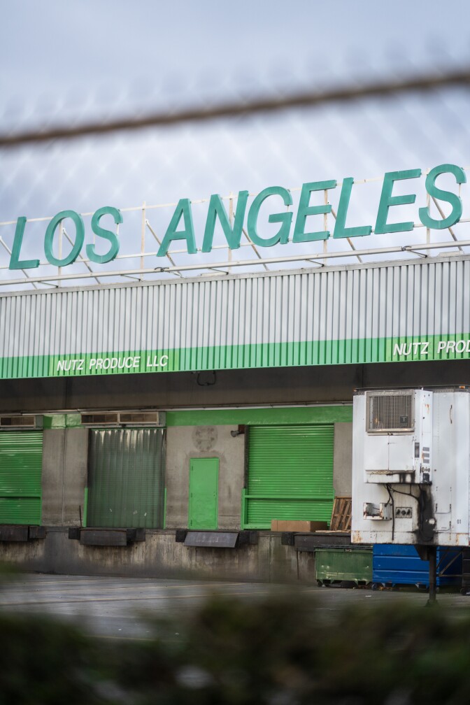 A photo of a green factory titled "Los Angeles" 