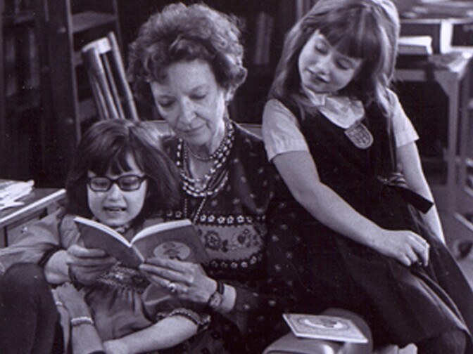 Madeleine L'Engle reads with her granddaughters, Charlotte and Lena, in 1976.