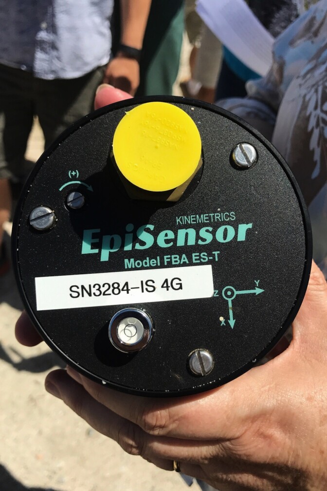 Lucy Jones holds a sensor, normally planted underground, that's used to detect earthquakes.