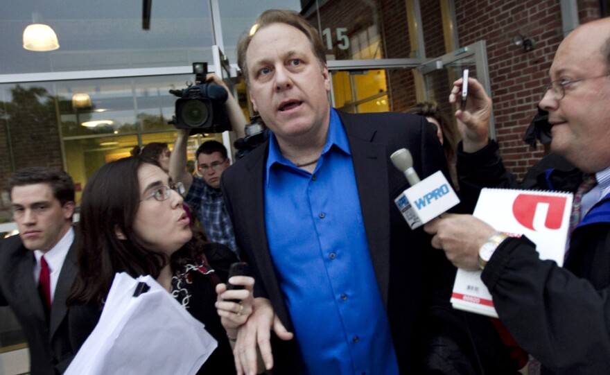 Former Boston Red Sox pitcher Curt Schilling had to push through a mob of reporters on Monday after meeting with Rhode Island officials to discuss the finances of his troubled video game company and ask for more state help.