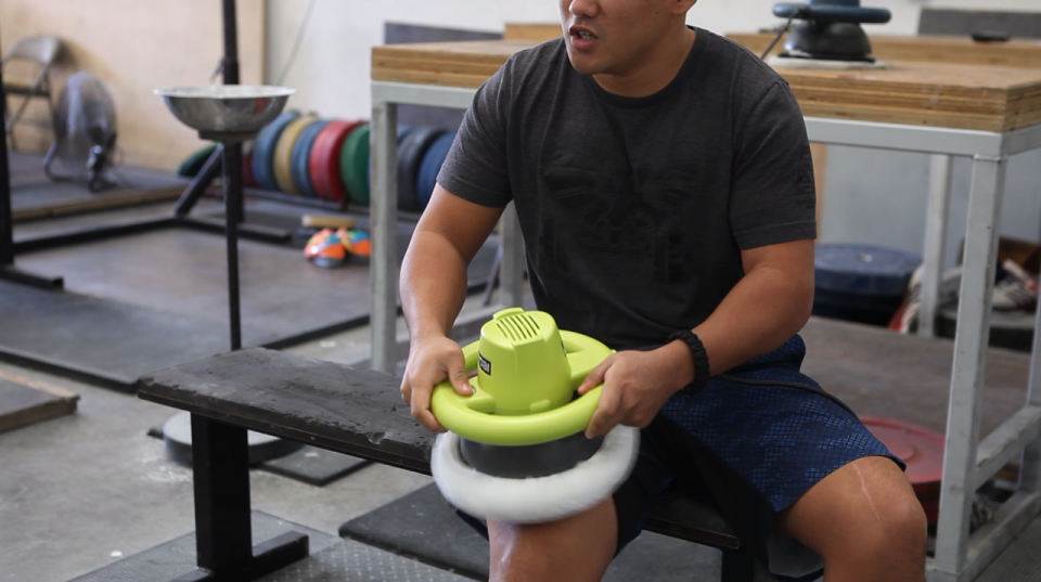Weightlifting coach Sam Chang uses the car buffer on his leg at Waxman's Gym in Lawndale in October 2017. 