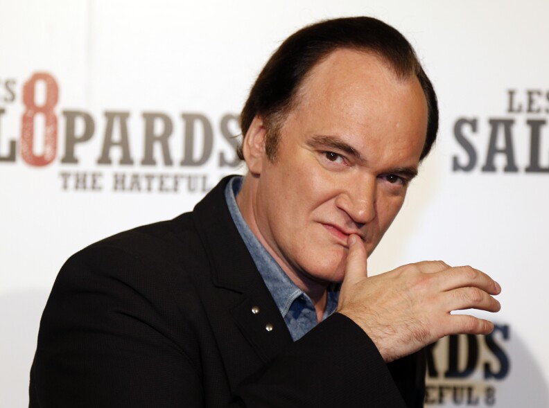 US director Quentin Tarantino poses during a photocall for the premiere of his latest movie "The Hateful Eight" (Les Huit Salopards) in Paris on December 11, 2015. 