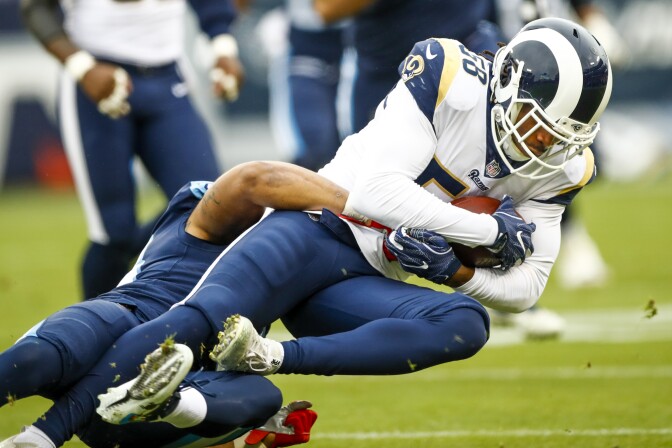 Outside Linebacker Cory Littleton #58 of the Los Angeles Rams carries the ball after an interception against the Tennessee Titians at Nissan Stadium on December 24, 2017 in Nashville, Tennessee.